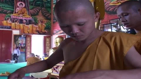 Young Thai Buddhist monks dressing in saffron robes for the first time. Stock Footage 10582053