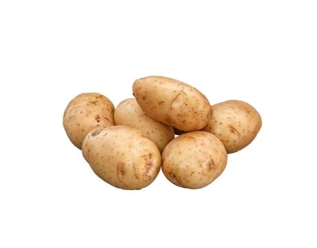 Young thin-skinned washed potatoes lies on a white background. Isolated on a Stock Photos