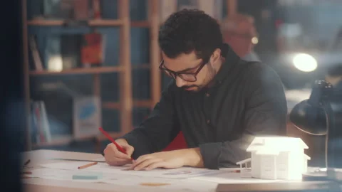 Young Thoughtful Arab Architect Working on Floor Plan in Office Stock Footage 133494032