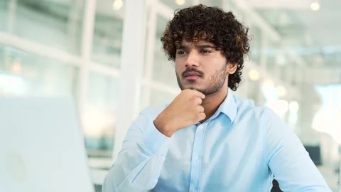 Young thoughtful IT professional programmer is concentrating on solving  Stock Footage 237332819
