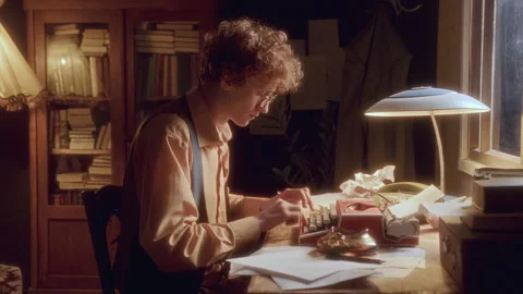 Young Thoughtful Writer Working on Old Typewriter at Desk in Cozy Study Stock Footage 285094133
