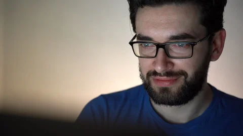 Young tired computer programmer working out new social net sitting at home Stock Footage 109181046