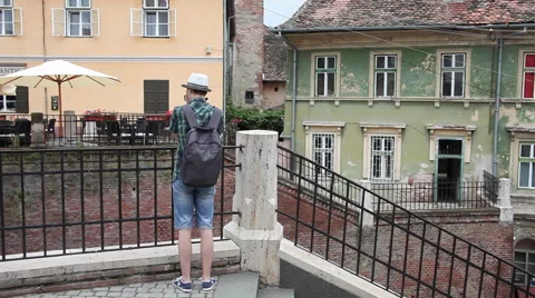 Young tourist with a camera, shooting, old town, architecture, Europe Stock Footage 40686291