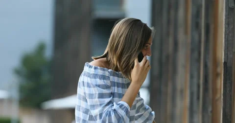Young tourist chatting on mobile while shopping Stock Footage 154897742