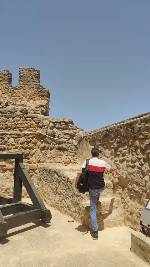Young tourist exploring ancient castle ruins Stock Footage 344692442