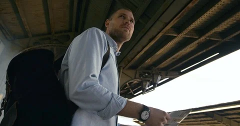 Young Tourist Looking At Map Stock Footage 78772231