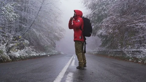 Young tourist lost in the mountain during winter, freezing conditions Stock Footage 119490636