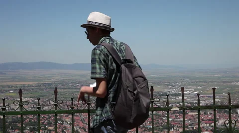 Young tourist, panorama view, looking to the city from above,taking pictures Stock Footage 40533136