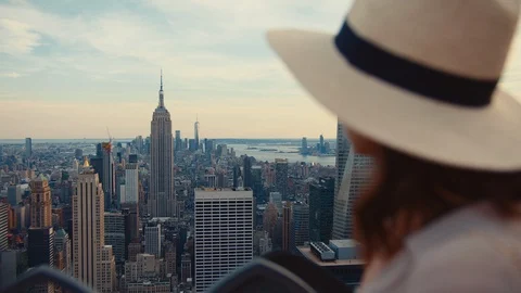 Young tourist on the roof of a skyscraper Stock Footage