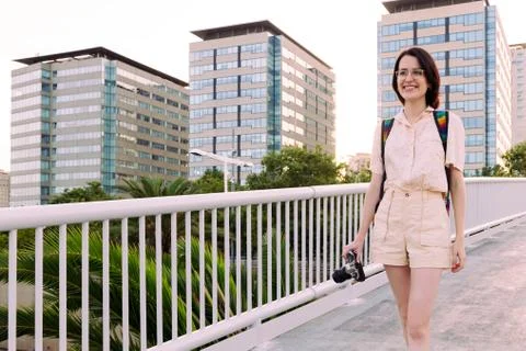 Young tourist walking in the city with a camera Stock Photos