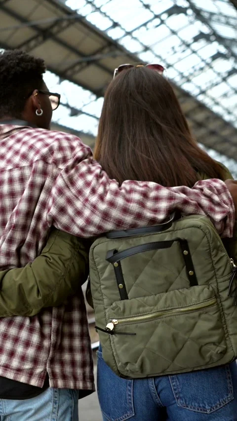 Young tourists couple walking in train station Stock Footage 311809580