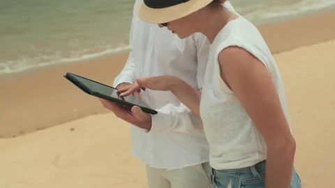 Young Tourists Using Tablet While Looking Through Online Map Stock Footage 227893248