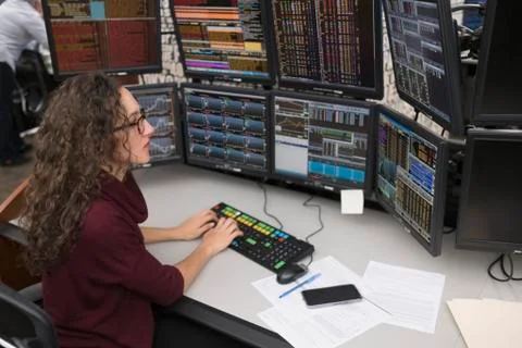 Young trader analyzing computer data Stock Photos