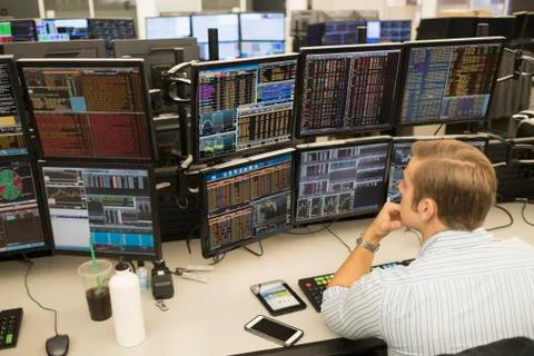Young trader analyzing computer data Foto stock