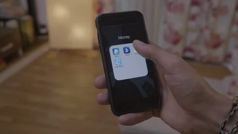 Young trader man accessing his financial statistics and bitcoin cryptocurencc Stock Footage 102798355