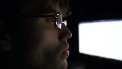 Young trader working on computer at night. Male financial analyst Stock Footage 306741086