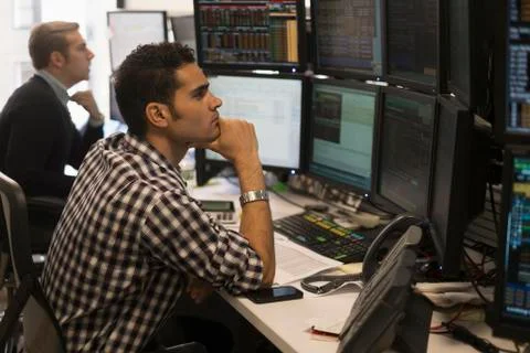 Young traders analyzing computer data Stock Photos