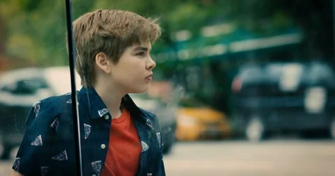 Young transgender boy looking away while standing on the street Stock Footage 108790639