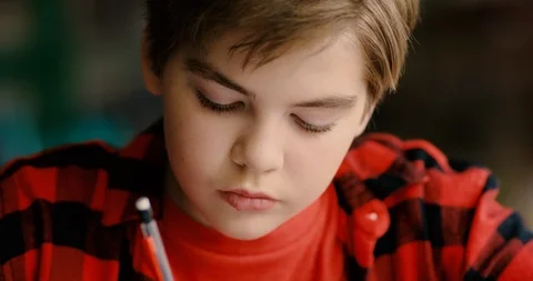 Young transgender boy studying in a classroom Stock Footage 108791416