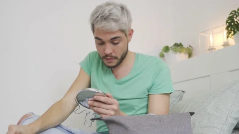 Young transgender man doing make-up before pride event - LGBT concept Stock Footage 170198936