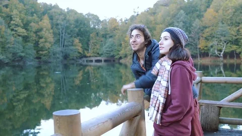 Young traveller couple exploring and enjoying the lake view Stock Footage 80932409