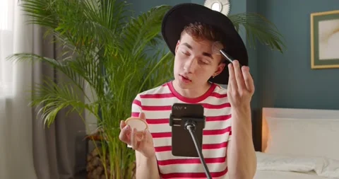 Young trendy man vlogger make beauty makeup tutorial, recording video Stock Footage 135534040