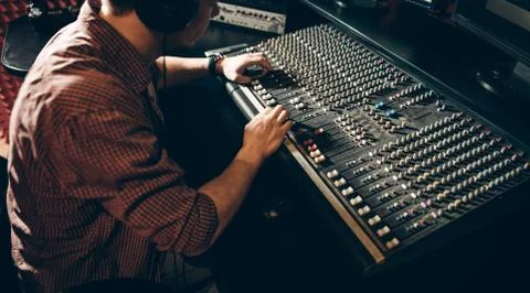 Young unexperienced learning the sound engineering Stock Photos