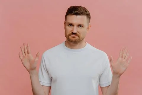 Young unhappy man refusing proposition and showing denial sign Stock Photos