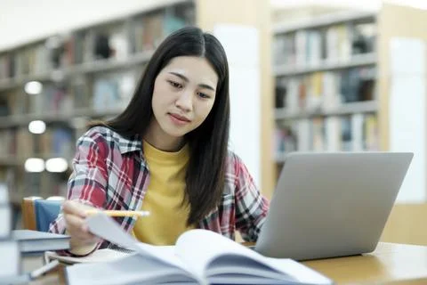 Young university student using laptop for online learning, searching and le.. Stock Photos