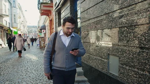 Young urban professional man using smart phone. Businessman holding mobile Stock Footage 47152124