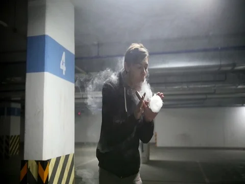 Young vaper makes amazing tricks with vapor