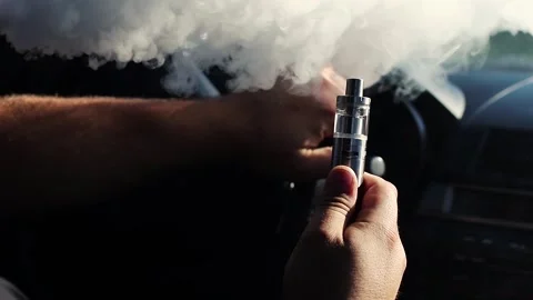 Young vaper man with beard vaping mechanical mod Stock Footage 244647902