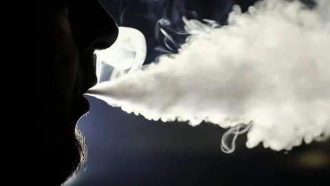 Young vaper man with beard vaping mechanical mod Stock Footage 244647906