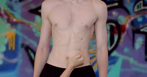 Young Vibrant Male Model Captured Lively Urban draw on belly Vídeo Stock 287705663