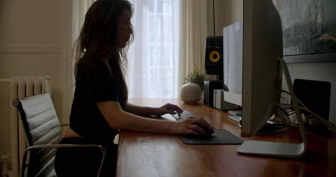 Young video editor working from her home office 스톡 동영상 131120848