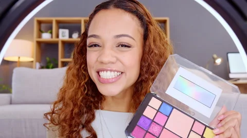 A young vlogger making a makeup tutorial video for social media blog using Stock Footage 201666431