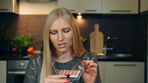 Young vlogger talking about makeup eye shadow. Attractive young woman talking Stock Footage 95779634