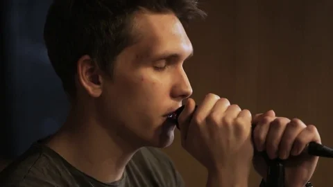 Young Vocalist Singing to the Microphone Stock Footage 72224103