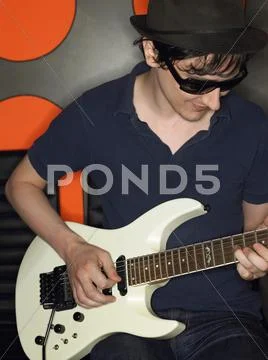Young Wan With Guitar In Recording Studio Stock Photos