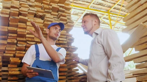 Young warehouse worker timber to communicate with customers Stock Footage 57095303