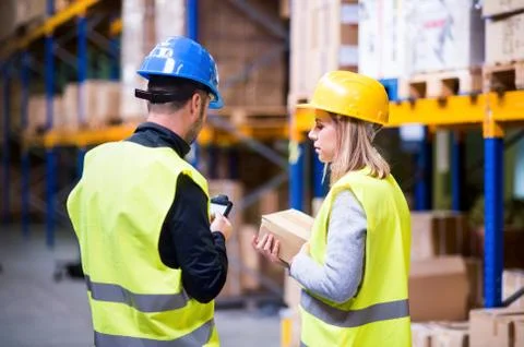 Young warehouse workers working together. Stock-Fotos