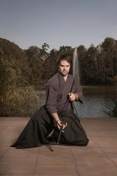 Young warrior practicing intense sword fighting techniques during training Stock Photos