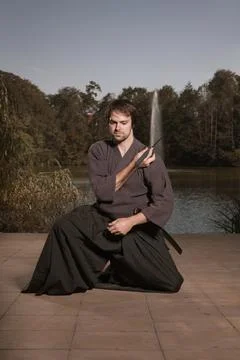 Young warrior practicing intense sword fighting techniques during training Stock Photos