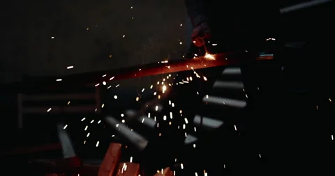 Young welder testing if the electrode on his eqipment is functioning. Lots 動画素材 265213712