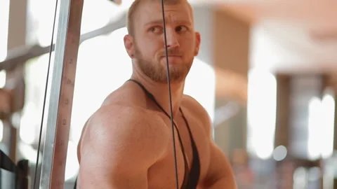 Young white bodybuilder training triceps in the gym Stock Footage 102228921