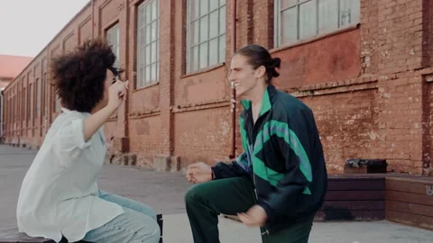 Young white guy makes proposal to her black girlfriend at the street of old town Vídeo Stock 220723257