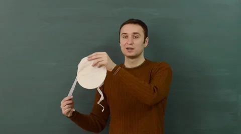 A young white male instructor explains how to use a protective dust mask. Stock Footage 68685220