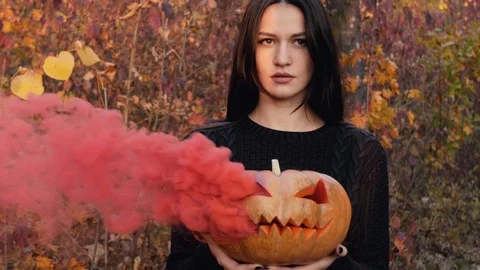 Young witch and her orange friend. Stock Footage 118306780