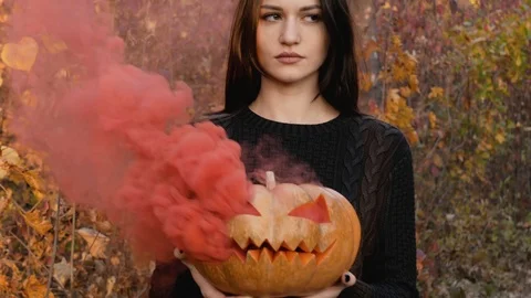 Young witch and her orange friend. Stock Footage 118306791