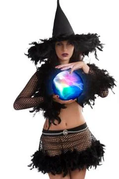 The young witch posing with magic ball Stock Photos